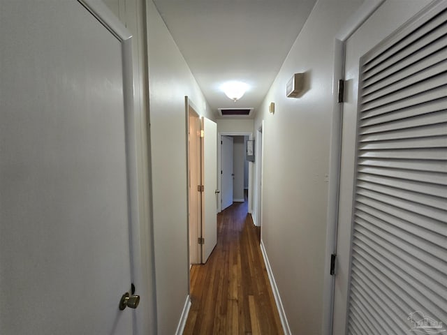 corridor with dark hardwood / wood-style floors
