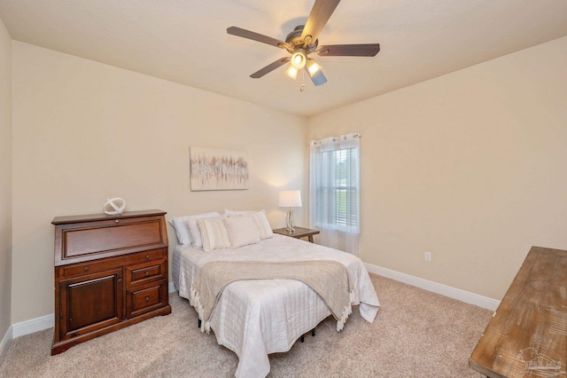 bedroom featuring light carpet and ceiling fan