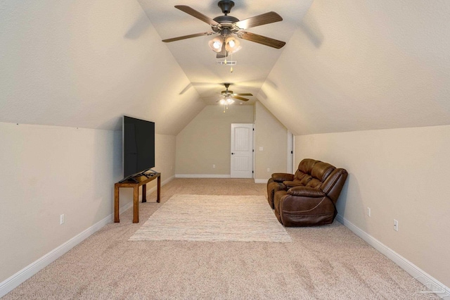 sitting room with light carpet, lofted ceiling, and ceiling fan