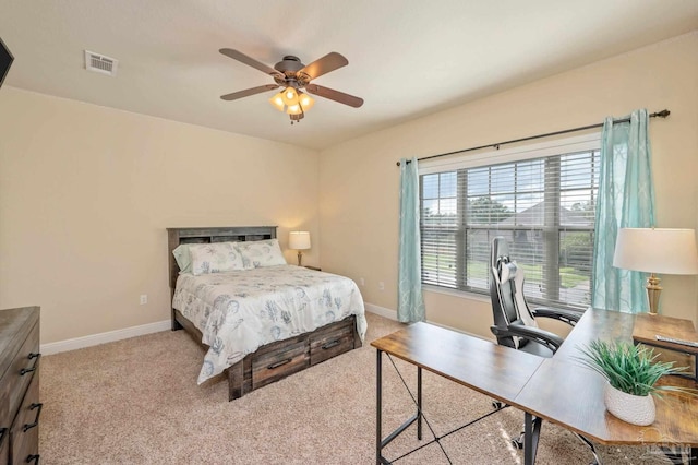 bedroom featuring ceiling fan and light carpet