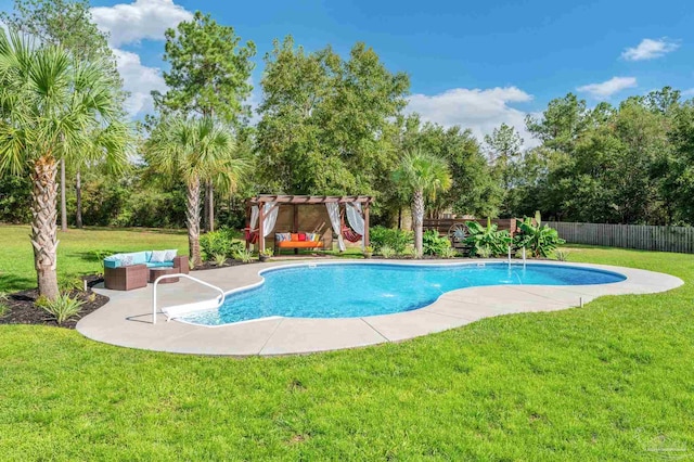 view of pool with a patio area and a lawn