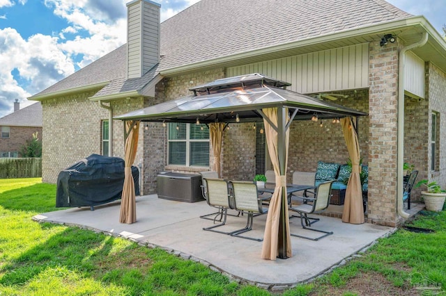 back of house with a patio, a gazebo, and a lawn