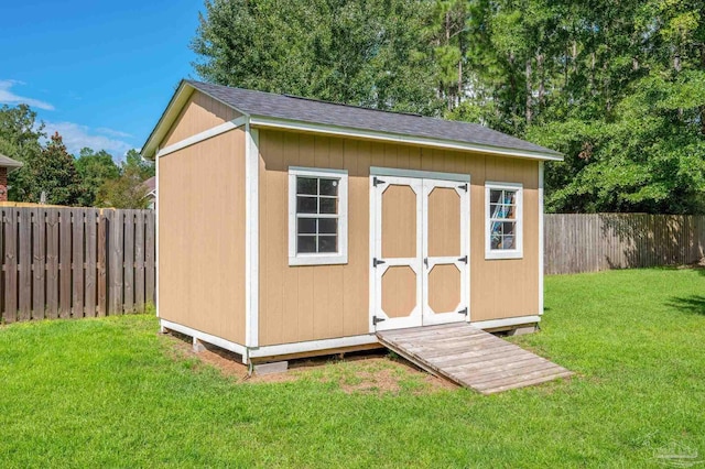 view of outdoor structure with a lawn