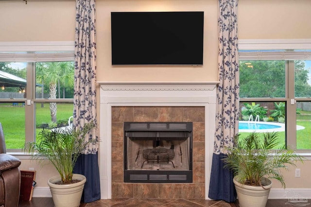 room details with a tile fireplace and tile patterned floors