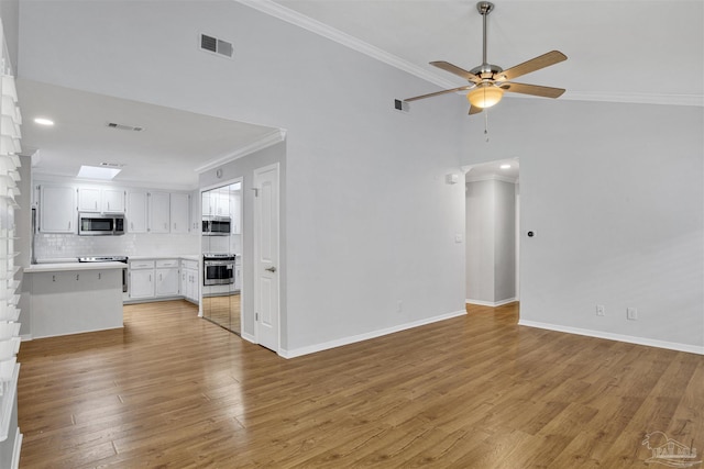 3108 Station Ct, Pensacola, FL 32504 - unfurnished living room featuring crown molding, a ceiling fan, light wood finished floors, and recessed lighting