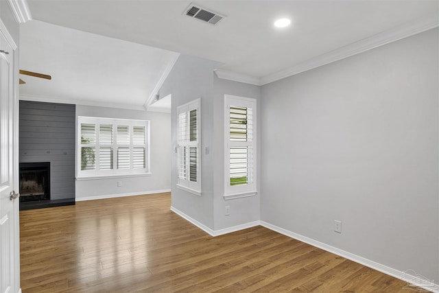 3108 Station Ct, Pensacola, FL 32504 - unfurnished living room with crown molding, plenty of natural light, wood finished floors, a fireplace, and recessed lighting
