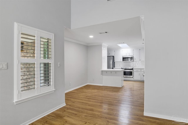 3108 Station Ct, Pensacola, FL 32504 - unfurnished living room featuring crown molding, light wood finished floors, and recessed lighting