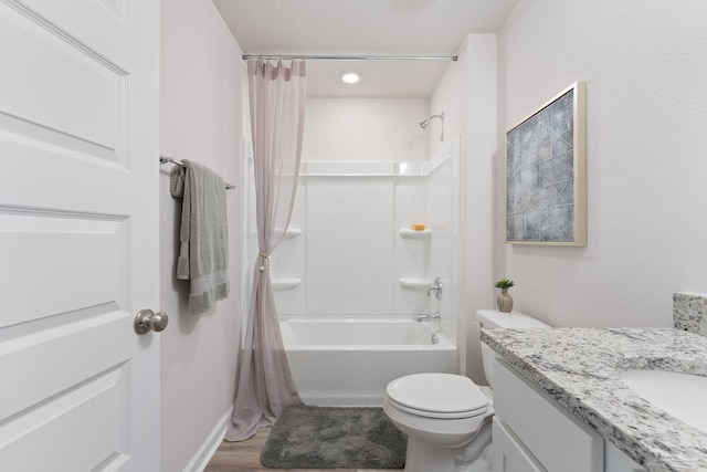 bathroom featuring shower / tub combo, toilet, wood finished floors, and vanity