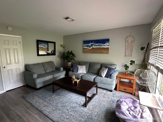 living room featuring plenty of natural light and hardwood / wood-style floors