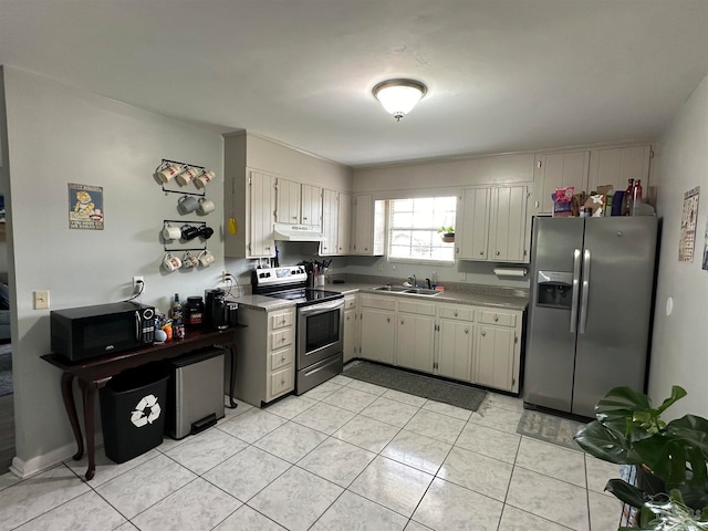 kitchen featuring sink, light tile patterned floors, and appliances with stainless steel finishes