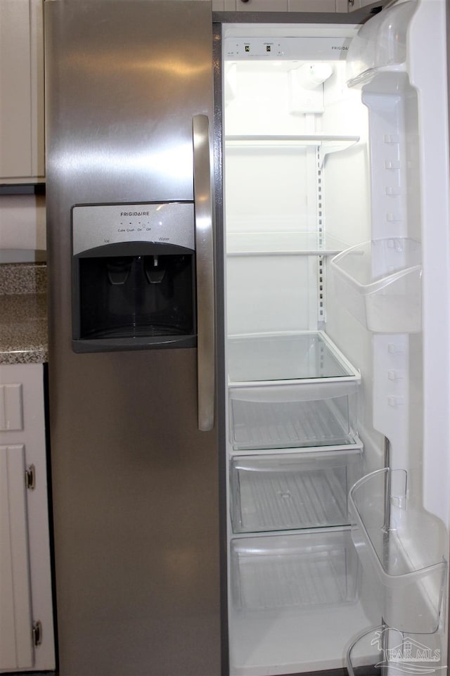 details with stainless steel fridge with ice dispenser