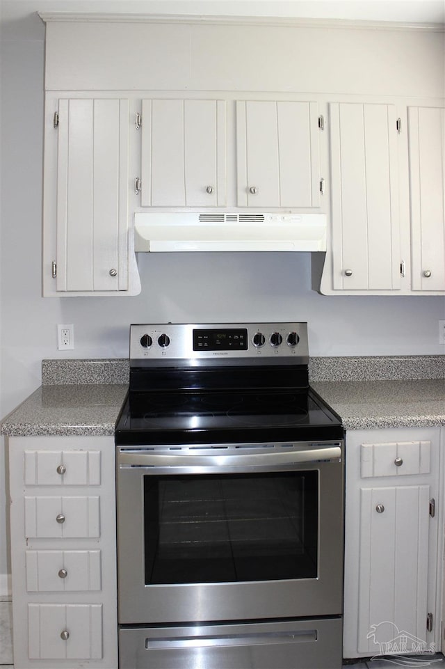 kitchen with white cabinetry and stainless steel range with electric cooktop