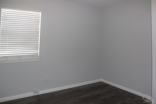 unfurnished room featuring dark hardwood / wood-style floors