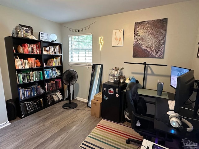 office space with wood-type flooring