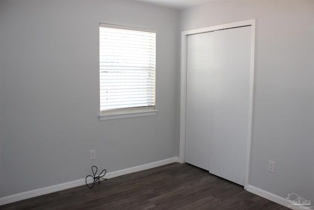 empty room featuring dark wood-type flooring