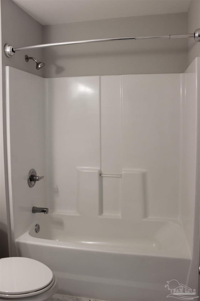 bathroom with shower / bathtub combination and toilet