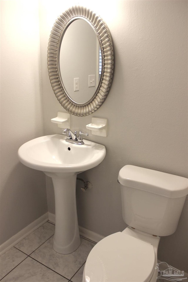 bathroom featuring tile patterned floors and toilet