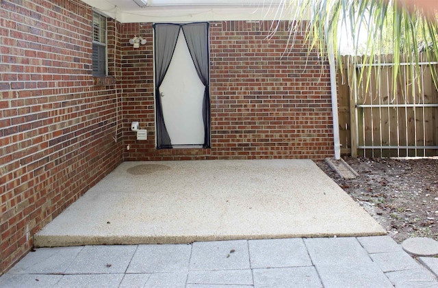 doorway to property with a patio