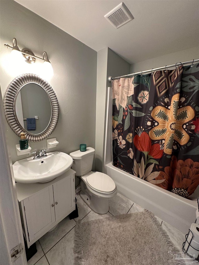 full bathroom with vanity, tile patterned floors, shower / bath combo with shower curtain, and toilet