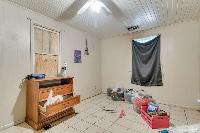 interior space with visible vents, baseboards, wooden ceiling, and a ceiling fan