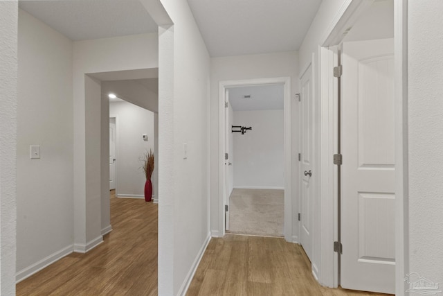 hallway featuring light wood-type flooring