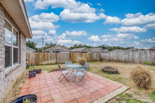 view of patio featuring an outdoor fire pit