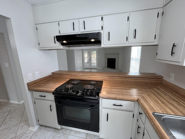 kitchen featuring under cabinet range hood, white cabinets, black electric range oven, and a sink