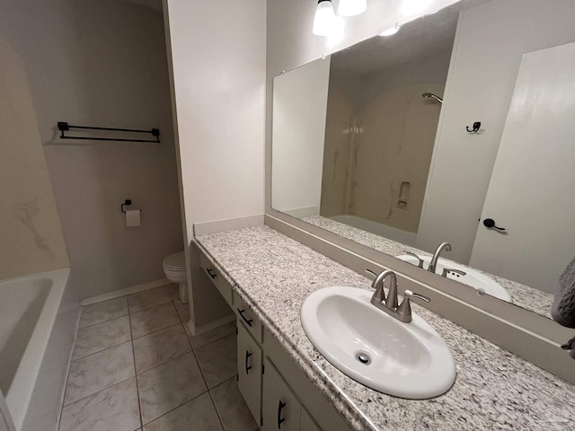 bathroom featuring vanity, baseboards,  shower combination, tile patterned flooring, and toilet