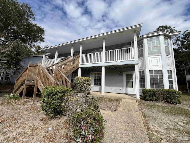 view of front of property featuring stairs