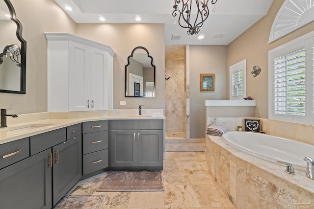 full bathroom featuring a bath, visible vents, a tile shower, and a sink