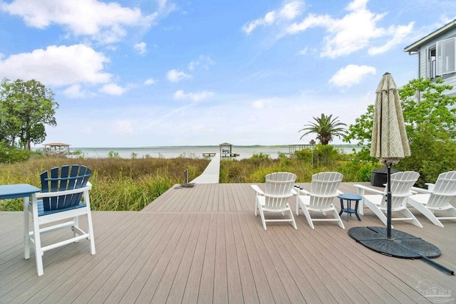 wooden terrace with a water view