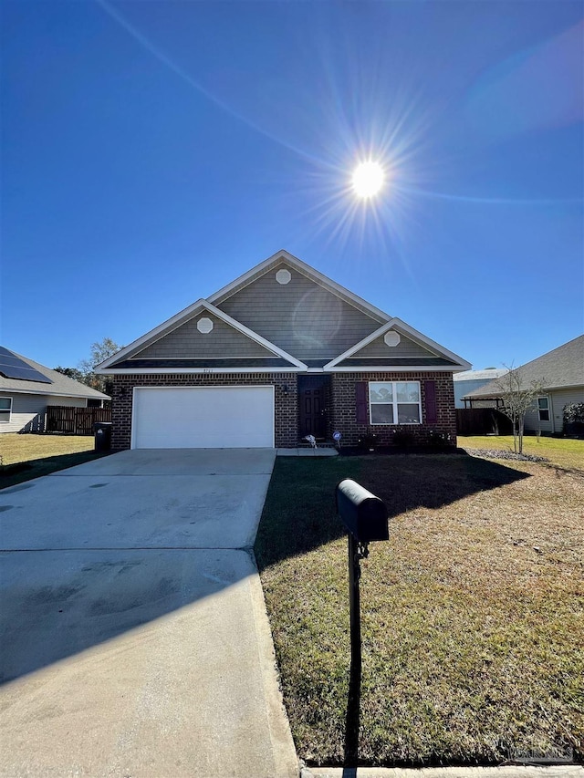 ranch-style house with a garage, brick siding, concrete driveway, and fence