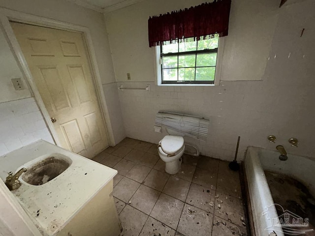 3010 N 6th Ave, Pensacola, FL 32503 - bathroom featuring toilet, a bathtub, a wainscoted wall, tile patterned floors, and vanity