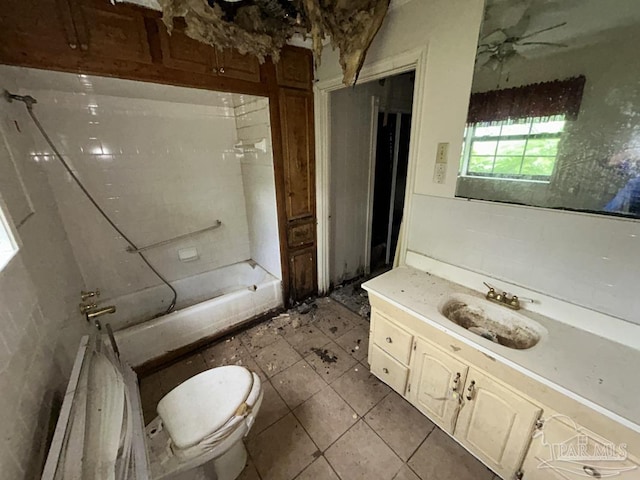 3010 N 6th Ave, Pensacola, FL 32503 - bathroom with tile patterned floors, vanity, toilet, and ceiling fan