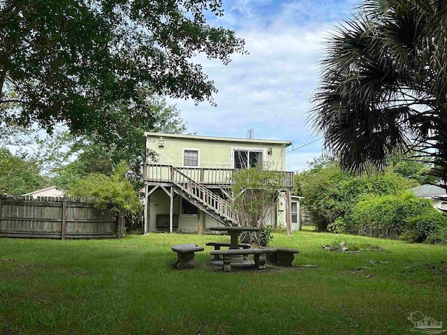 rear view of house with a lawn