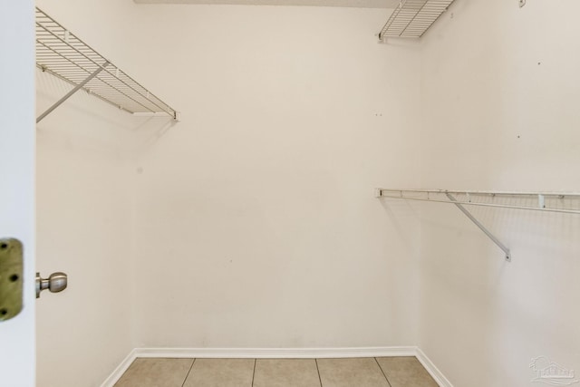 walk in closet featuring light tile patterned floors