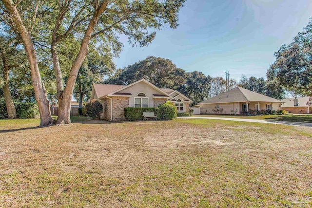 ranch-style house with a front lawn