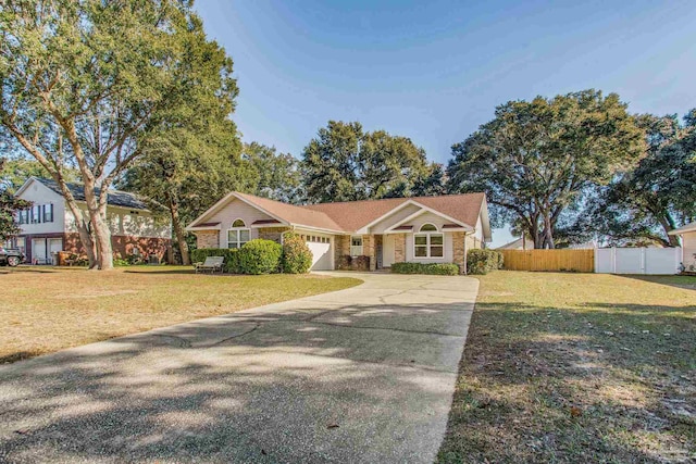 ranch-style home with a front lawn and a garage