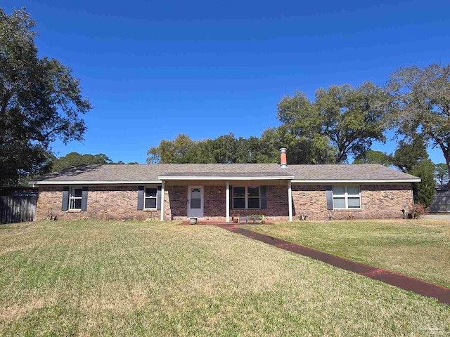 ranch-style house with brick siding and a front lawn