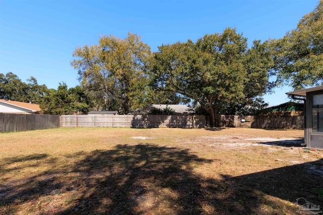 view of yard with a fenced backyard