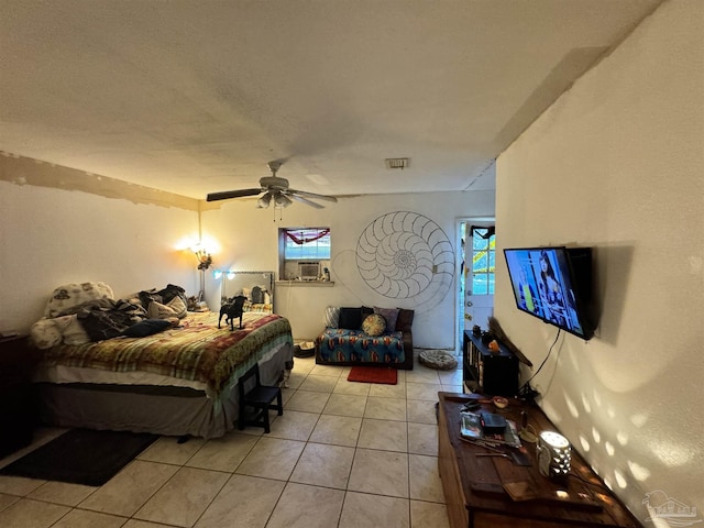 bedroom with ceiling fan and light tile patterned floors