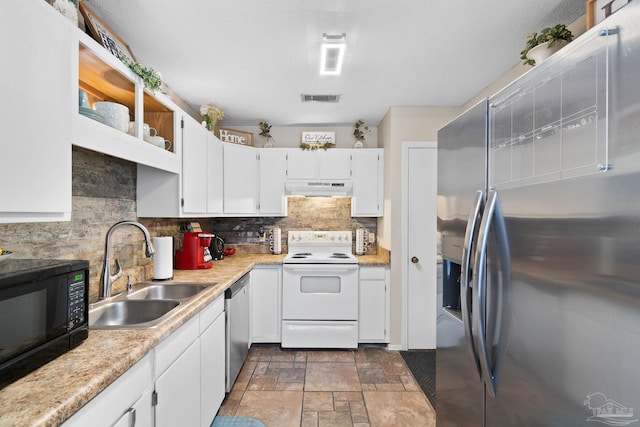 4701 Kitty Hawk Cir, Gulf Breeze, FL 32563 - kitchen with stainless steel appliances, a sink, under cabinet range hood, tasteful backsplash, and white cabinets