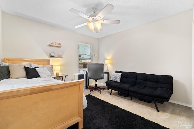 4701 Kitty Hawk Cir, Gulf Breeze, FL 32563 - carpeted bedroom featuring a ceiling fan, baseboards, and a desk