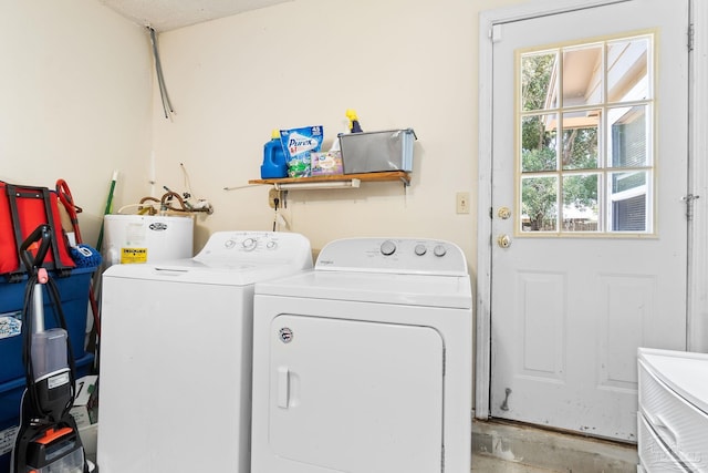 4701 Kitty Hawk Cir, Gulf Breeze, FL 32563 - laundry room featuring water heater and separate washer and dryer