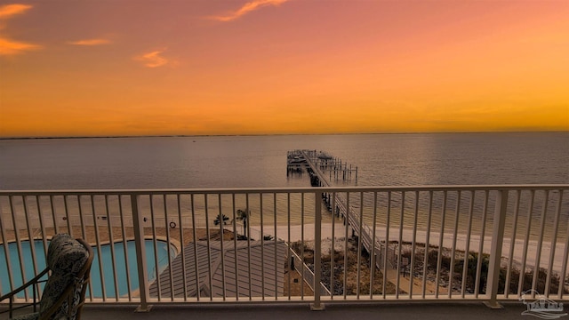 balcony at dusk with a water view