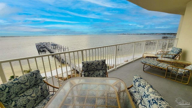 balcony featuring a water view