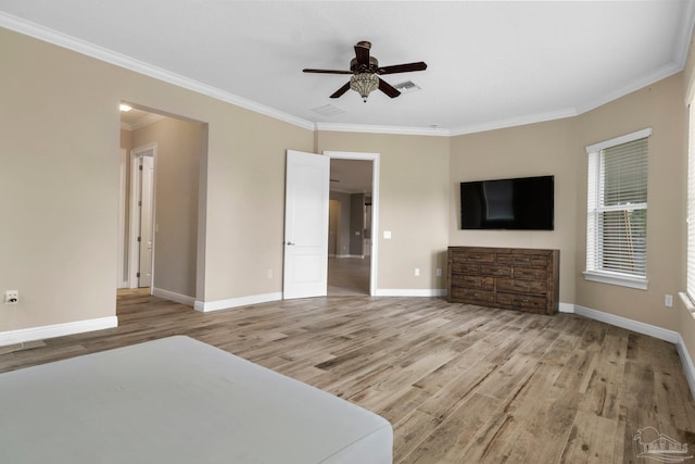 unfurnished bedroom with hardwood / wood-style floors, ceiling fan, and crown molding