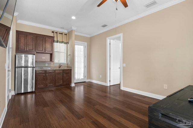 kitchen with ornamental molding, stainless steel fridge, dark hardwood / wood-style flooring, and ceiling fan