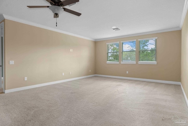 carpeted spare room featuring crown molding, a textured ceiling, and ceiling fan