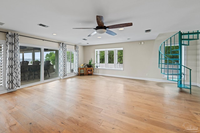 2950 Coral Strip Pkwy, Gulf Breeze, FL 32563 - spare room with a ceiling fan, stairs, baseboards, hardwood / wood-style floors, and recessed lighting